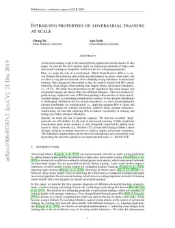 Intriguing properties of adversarial training at scale